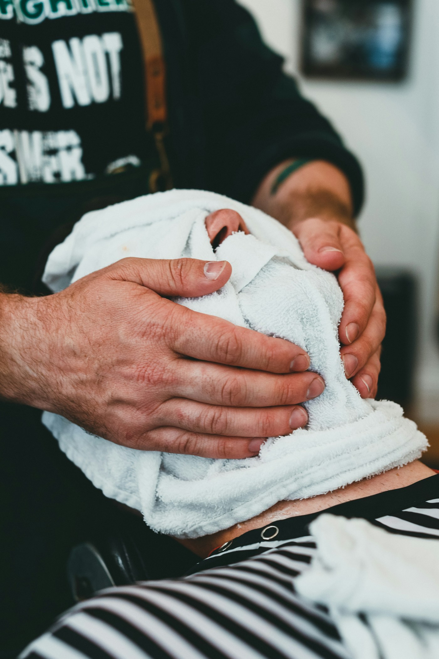 Hot towel laid over a client's face